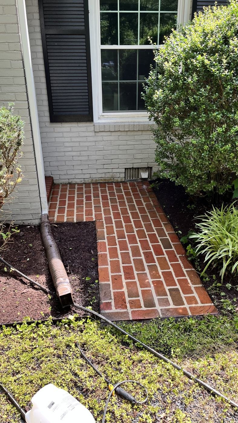 After — brick walkway pressure washed clean
