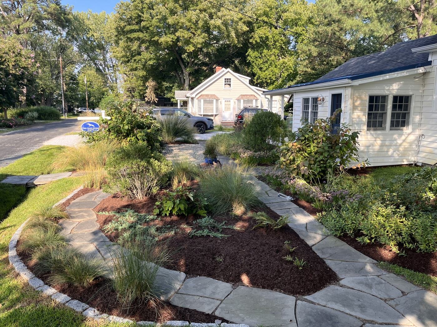 Full front yard view after weeding, edging, and mulching