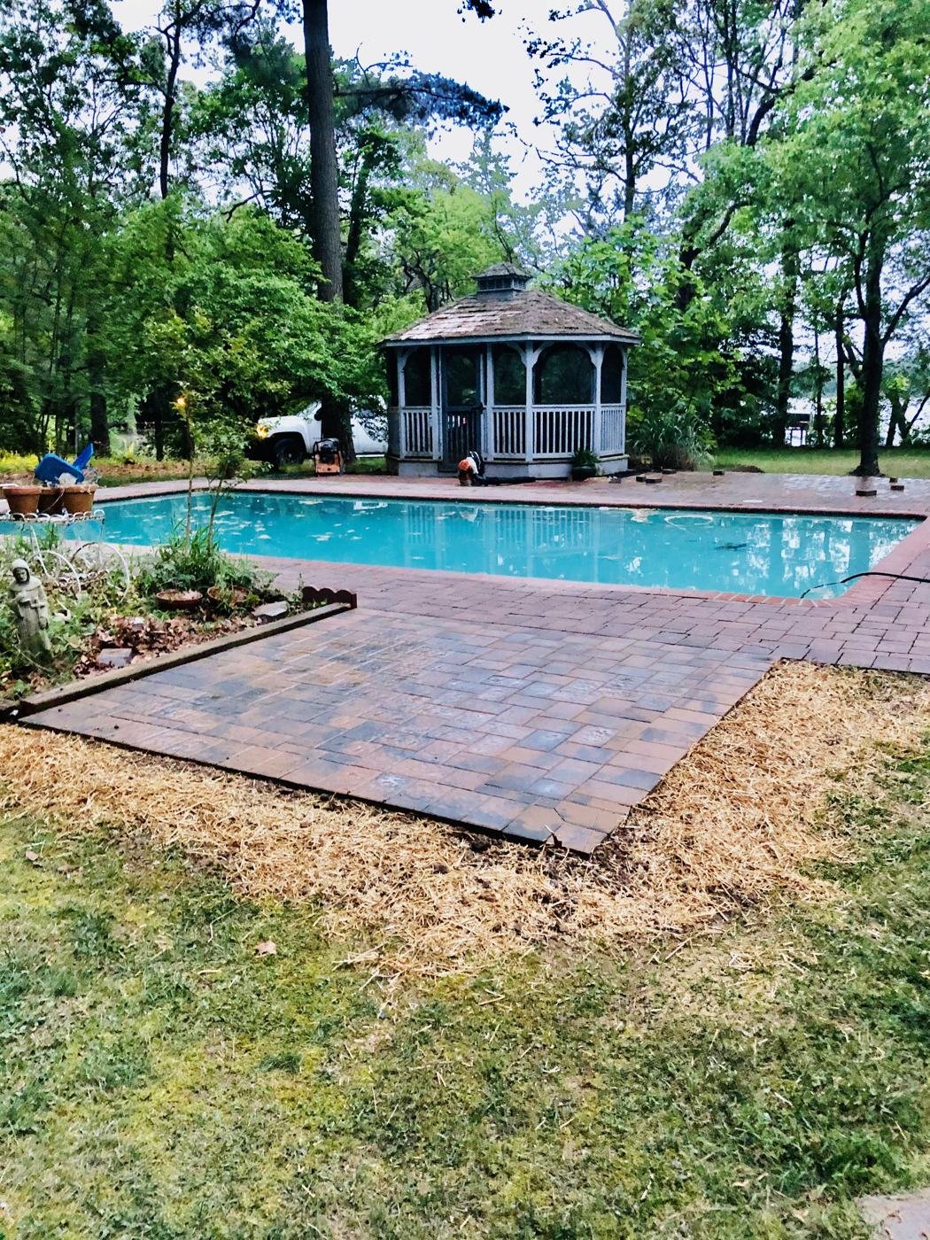 After — new paver patio by the pool and gazebo