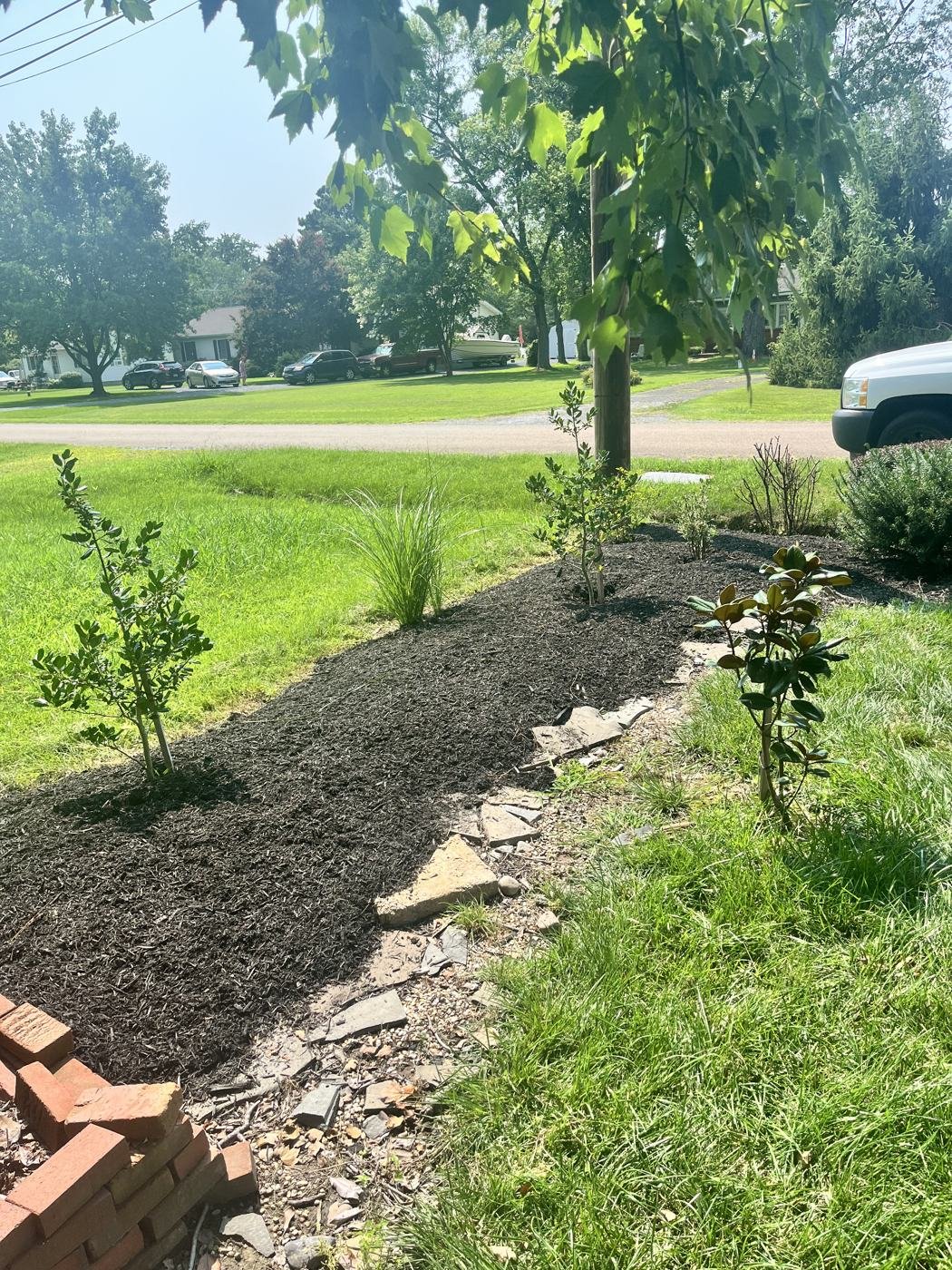 After — garden bed freshly mulched after weeding